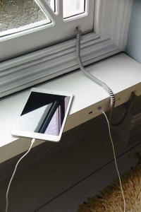 Stained-Glass Solar Window Charging a Tablet
