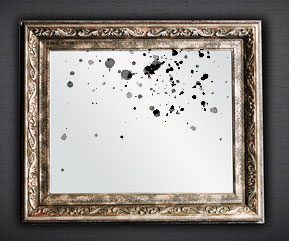 An Antique Mirror with Black Spots