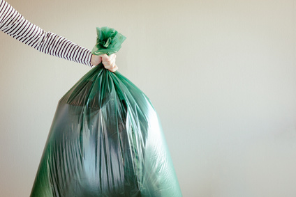 Man holding garbage bag - need to recycle