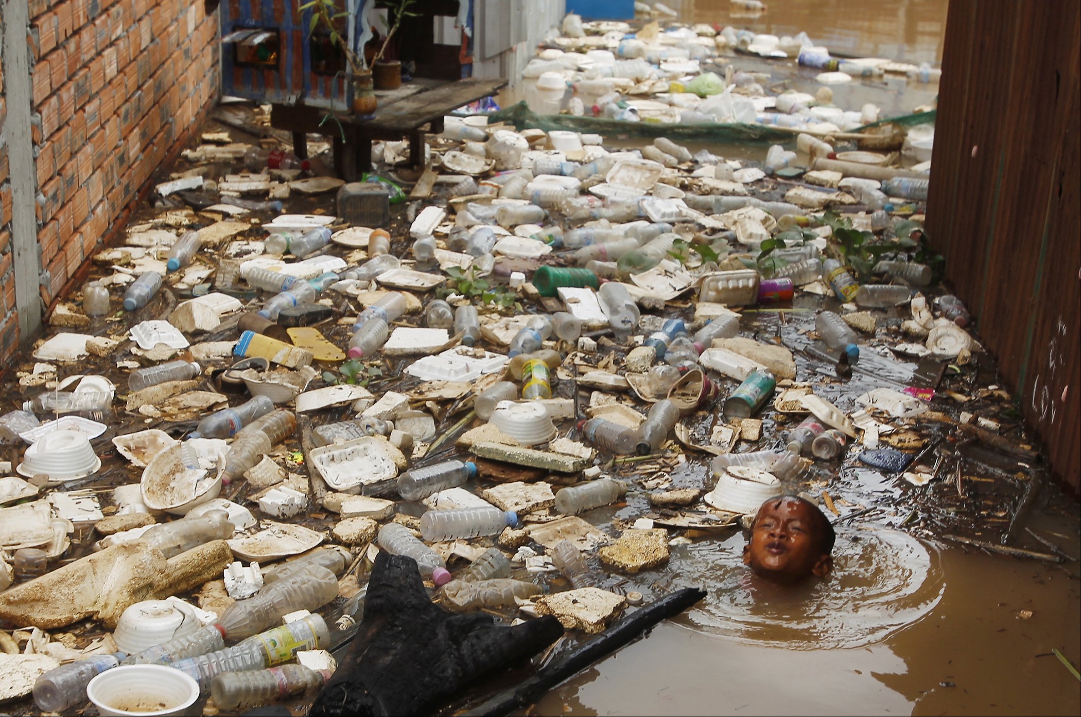 Polluted Water with child swimming